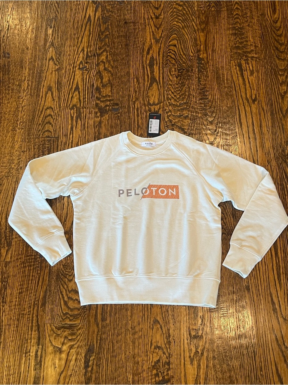 Peloton Unisex Cream Crewneck with Pink Logo